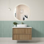 Aulic Venetta fluted wall hung vanity in Harvest Oak with white top and round vessel basin, shown in a bathroom setting