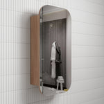 Aulic Vienna shaving cabinet with mirrored door and woodgrain side panel, wall mounted against white tiled bathroom wall