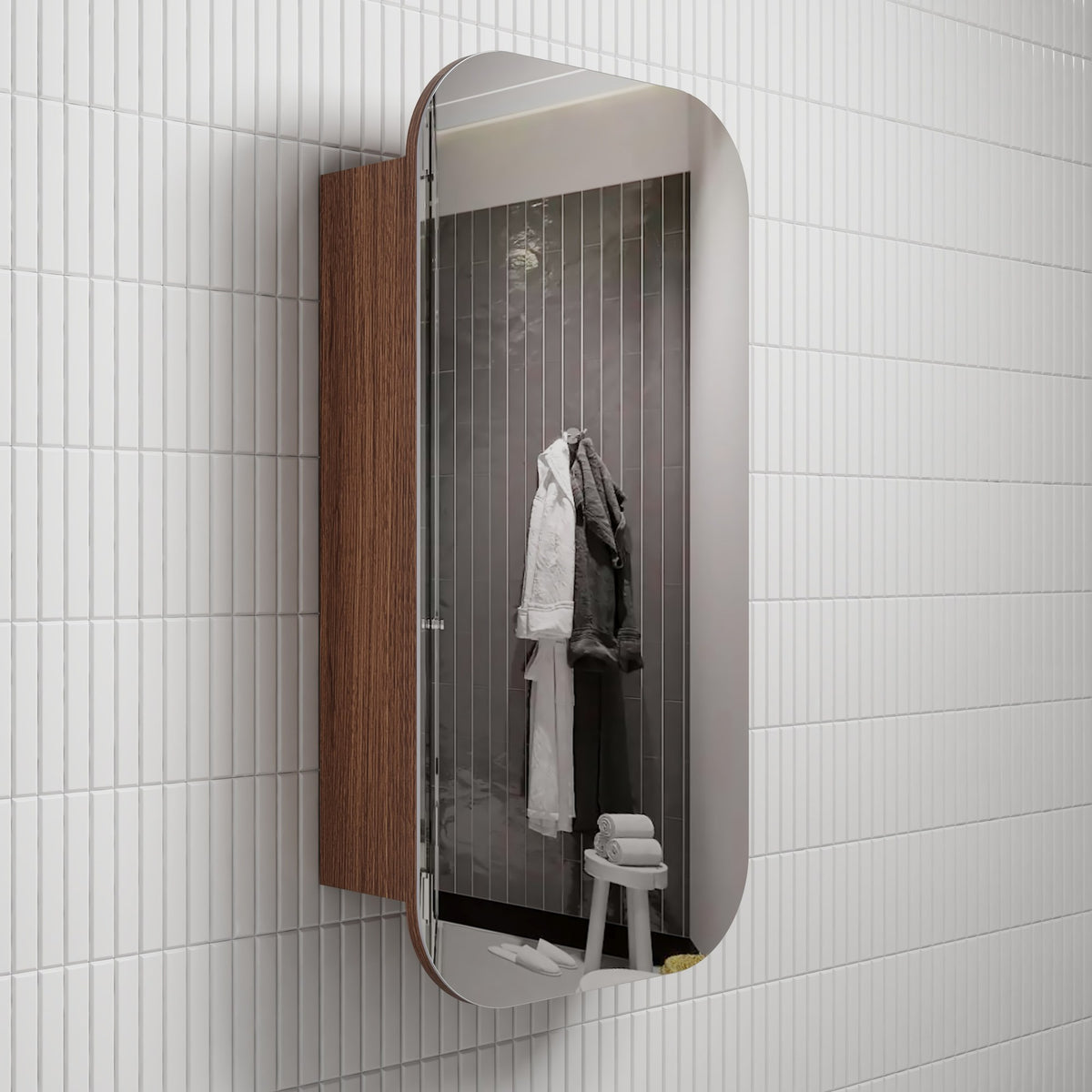 Aulic Vienna shaving cabinet with mirrored door, walnut woodgrain side panel and rounded rectangular profile in bathroom setting