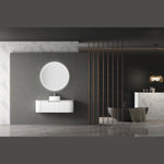 Aulic Windsor round LED mirror, wall mounted and lit, shown above a white vanity in a modern bathroom setting