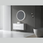 Aulic Windsor round LED mirror in matte black, wall mounted above a white vanity in a modern bathroom setting