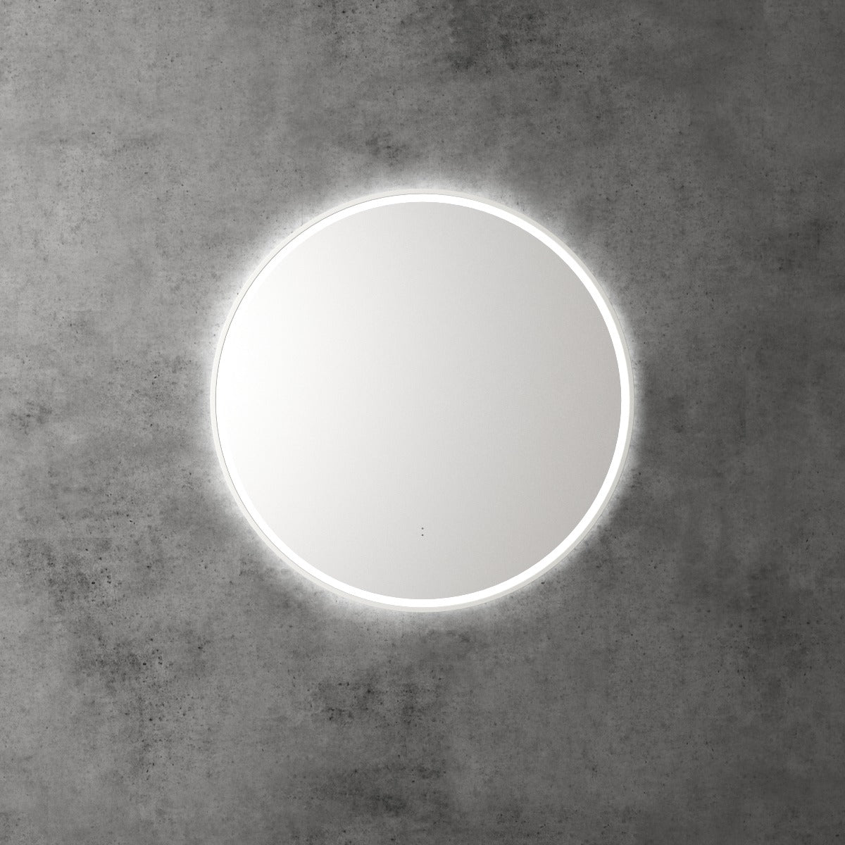 Aulic Windsor round LED mirror with backlit halo, mounted on a concrete wall, front view