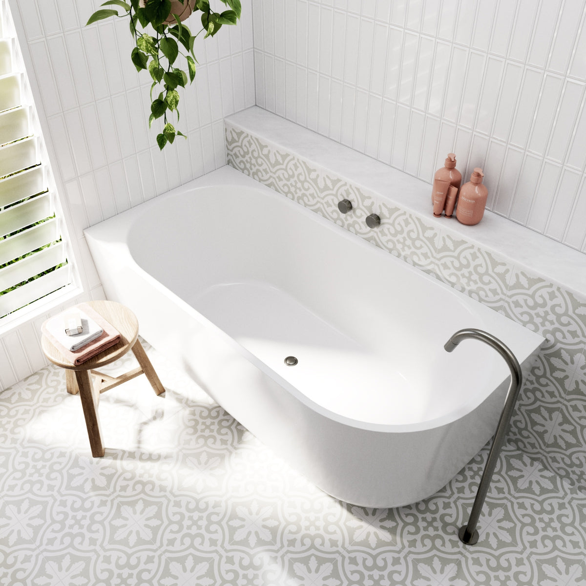 Bao Elegant white corner bath in a bright bathroom, shown with patterned tiling, wall niche and matte black tapware