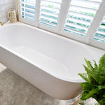 Bao Elegant white acrylic back-to-corner bath in a bright bathroom setting, with a curved modern oval profile