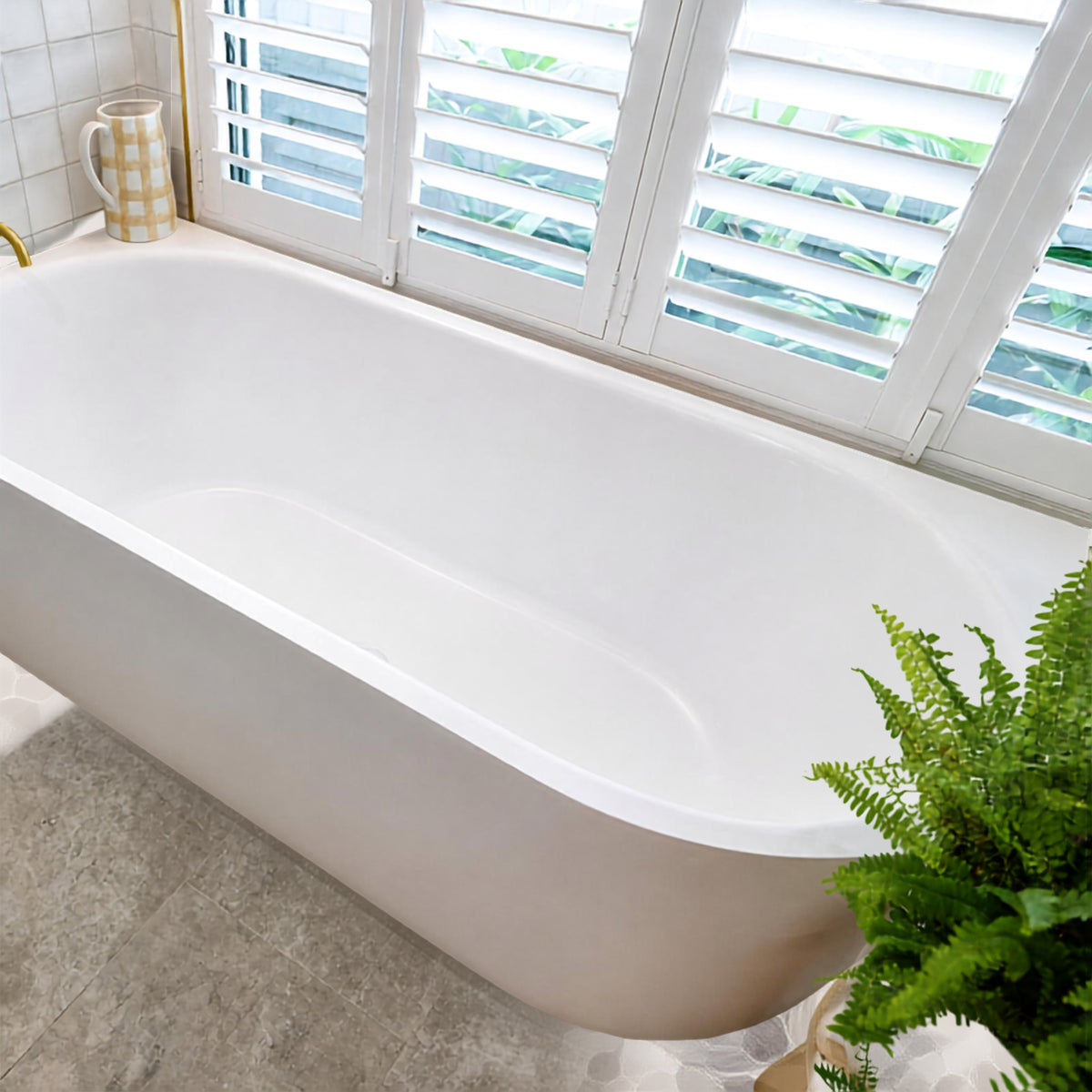 Bao Elegant white acrylic back-to-corner bath in a bright bathroom setting, with a curved modern oval profile