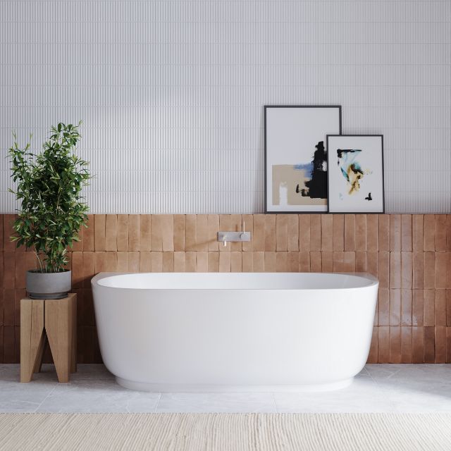 Bao Elegant back to wall bath in gloss white, shown front-on in a modern bathroom setting with wall tiles and artwork