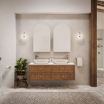 Dual Caroma above-counter oval basins in matte clay on a timber vanity, shown in a contemporary bathroom setting