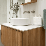 Nero Mecca wall basin mixer with separate back plate in brushed nickel, wall-mounted over a bathroom vanity sink.