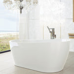 Caroma Blanc white freestanding oval bath in a modern bathroom, side view with floor-mounted tap and window outlook