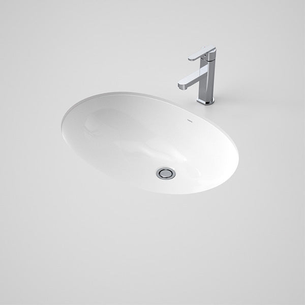 Caroma Caravelle white oval under counter vanity basin with chrome waste and mixer tap shown in bench cut-out view