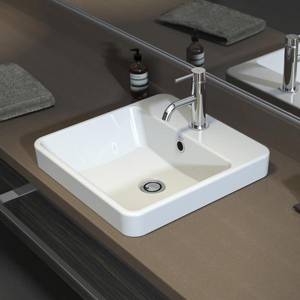 Caroma Carboni white square inset vanity basin with chrome waste, shown in a bathroom vanity benchtop view