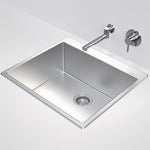 Caroma Urbane II stainless steel laundry tub, inset rectangular sink with basket waste and no tapholes shown against a wall