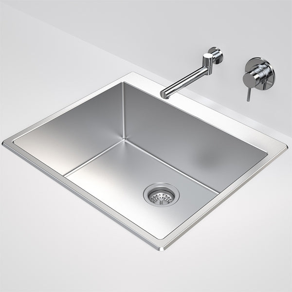 Caroma Urbane II stainless steel laundry tub, inset rectangular sink with basket waste and no tapholes shown against a wall