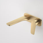 Caroma Contura II wall basin/bath mixer in brushed brass, wall-mounted with slim spout and lever handle