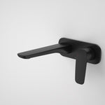 Caroma Contura II wall basin/bath mixer in matte black, wall-mounted with long spout and lever handle on white wall