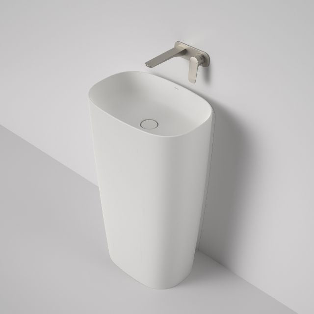 Caroma Contura II matte white freestanding basin, oval ceramic wall-mounted tapware shown