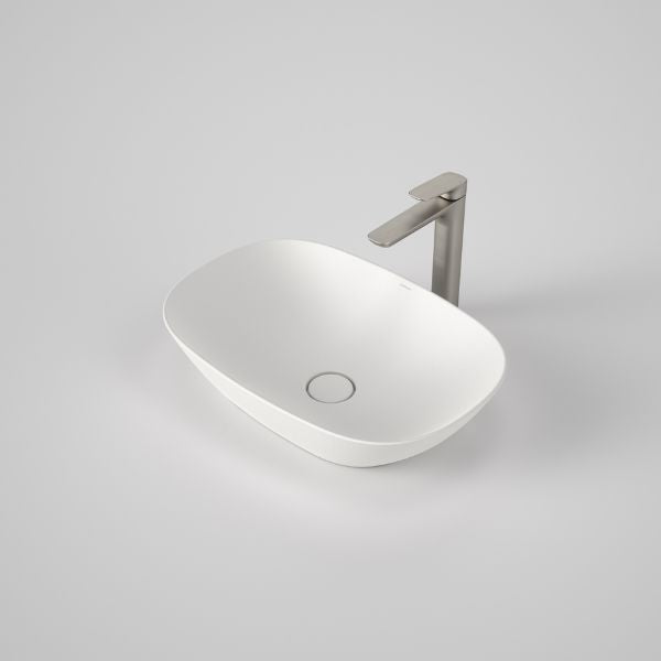 Caroma Contura II matte white oval above counter basin with flush waste, shown with tall mixer tap on a vanity top