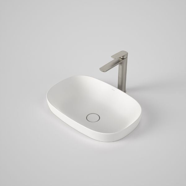 Caroma Contura II matte white oval inset basin with flush waste and chrome mixer tap, front view on grey background