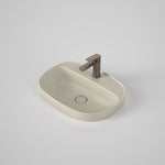Caroma Contura II matte clay oval inset basin with 1 tap hole and tap landing, shown with mixer tap