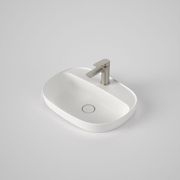 Caroma Contura II matte white oval inset basin with tap landing and 1 tap hole, shown with mixer tap