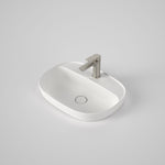 Caroma Contura II matte white oval inset basin with tap landing and 1 tap hole, shown with mixer tap