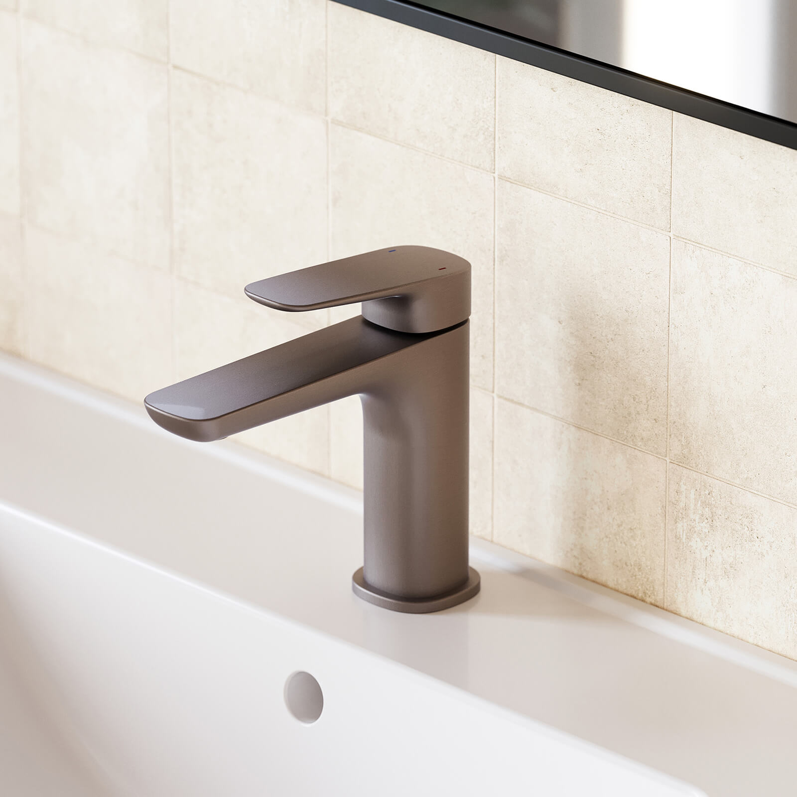 Caroma Contura II basin mixer in brushed bronze, close-up on a white basin against tiled wall