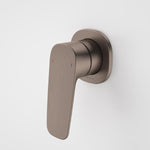 Caroma Contura II wall-mounted bath/shower mixer in brushed bronze, single lever tap on round backplate