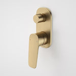 Caroma Contura II brushed brass bath/shower mixer with diverter, wall-mounted, on white background