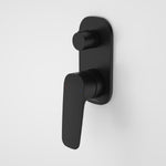 Caroma Contura II wall-mounted bath and shower mixer with diverter in matte black, round handle on black backplate