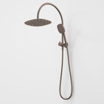 Caroma Contura II compact twin shower in brushed bronze, with round overhead shower and hand shower on rail