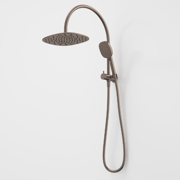 Caroma Contura II compact twin shower in brushed bronze, with round overhead shower and hand shower on rail