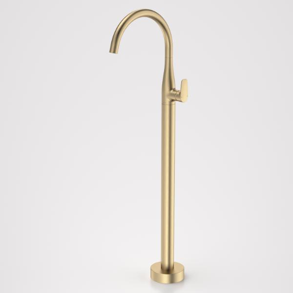 Caroma Contura II freestanding bath filler tap in brushed brass, floor mounted with curved spout and lever handle