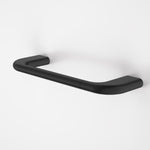 Caroma Contura II matte black hand towel rail with curved organic design, wall-mounted