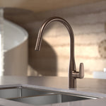 Caroma Contura II brushed bronze pull out sink mixer on a kitchen sink, side view of tapware
