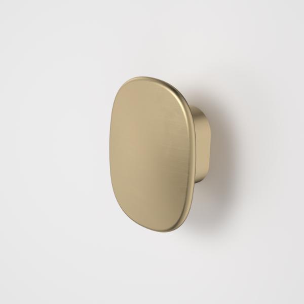 Caroma Contura II small robe hook in brushed brass, shown front-on on a white background