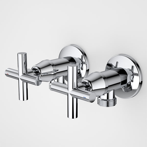 Caroma chrome washing machine tap set with cross handles and wall-mounted circular plates, shown pair on white background