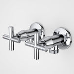 Caroma chrome washing machine tap set with cross handles and wall-mounted circular plates, shown pair on white background