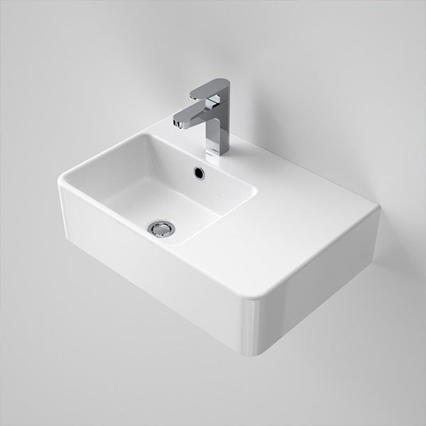 Caroma Cube 570mm wall-hung rectangular basin with right-hand shelf, white finish and chrome tap, front angle