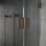 Caroma glass-to-glass shower door hinge in brushed bronze, fitted to frameless glass shower panels