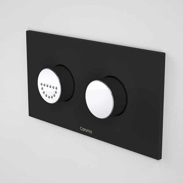 Caroma Invisi Series II round dual flush plate with raised care buttons, midnight black, wall-mounted view