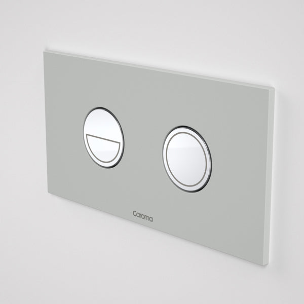 Caroma Invisi Series II round dual flush metal flush plate and buttons in light grey, wall-mounted