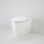 Caroma Liano white wall-faced toilet pan with soft-close seat, shown in a minimalist bathroom corner view