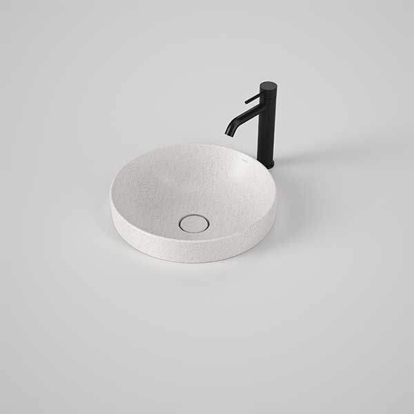 Caroma Liano II round inset basin in matte speckled white ceramic, shown with black mixer tap and pop-up waste