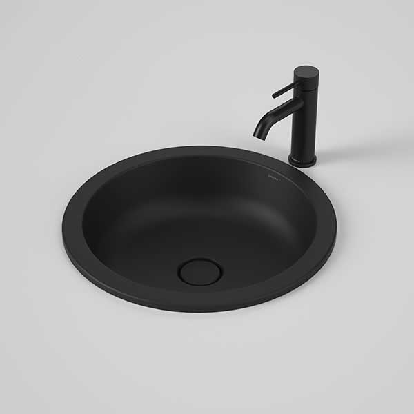 Caroma Liano II round matte black under/over counter basin with matching pop-up waste and black mixer tap out above the bowl