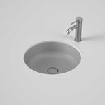 Caroma Liano II round matte grey under-counter basin with matching plug and waste, shown with mixer tap