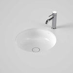 Caroma Liano II round white under/over counter basin with chrome mixer tap shown on a clean benchtop