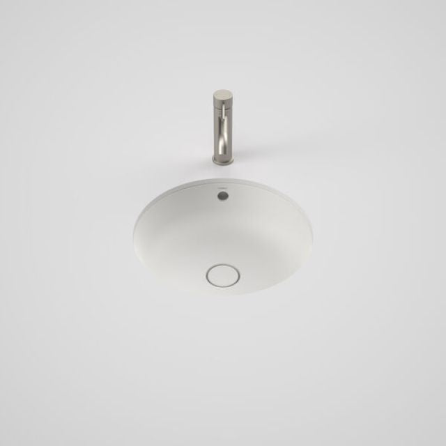 Caroma Liano II round white ceramic basin, under/over counter view with overflow and waste hole visible
