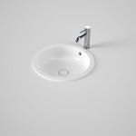 Caroma Liano II round white ceramic basin with overflow, shown under-counter with chrome tap on benchtop