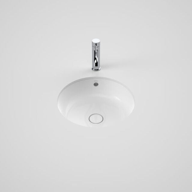 Caroma Liano II round white basin with overflow and chrome waste, shown under counter with tap above on white background
