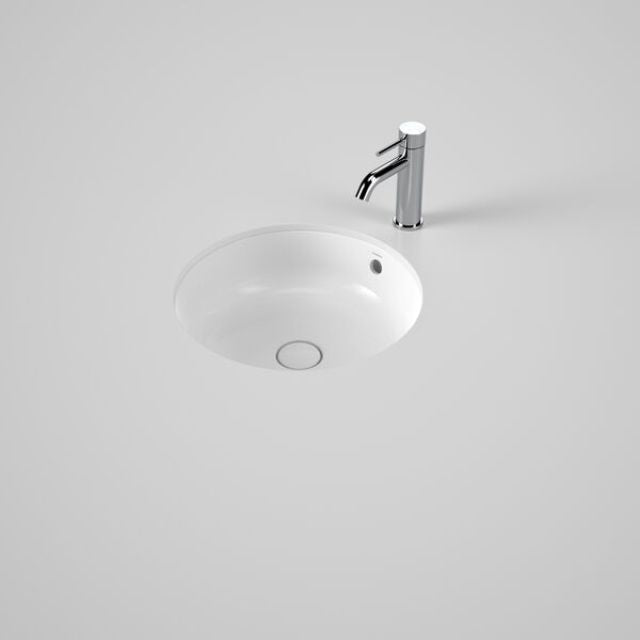Caroma Liano II round white ceramic basin with overflow, shown under counter with chrome tap on a benchtop